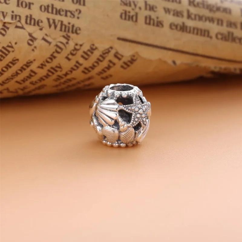 (kép) PANDORA Charm Áttört tengeri csillag, kagyló és szív - 798950C00 - Megtekintés 2