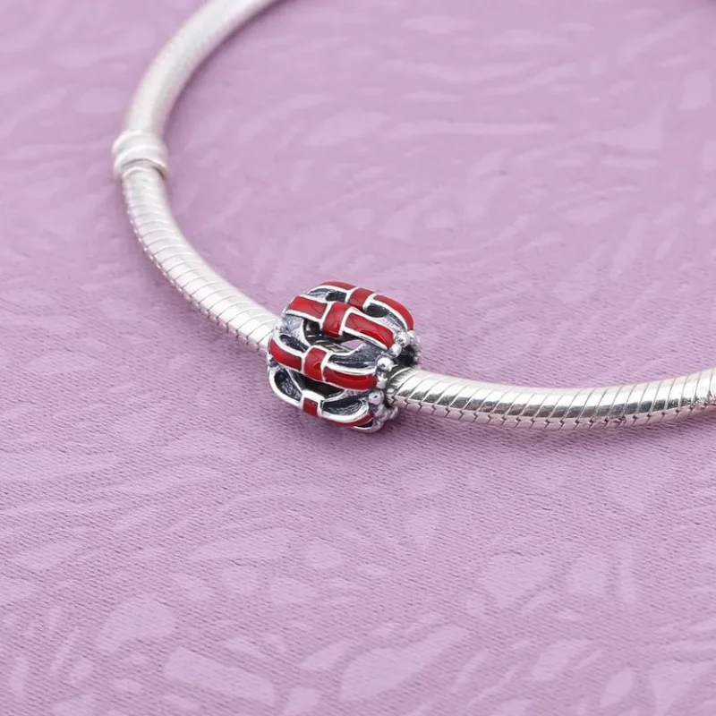(kép) PANDORA Áttört mintás masnis charm - 791778EN40 - Megtekintés 2